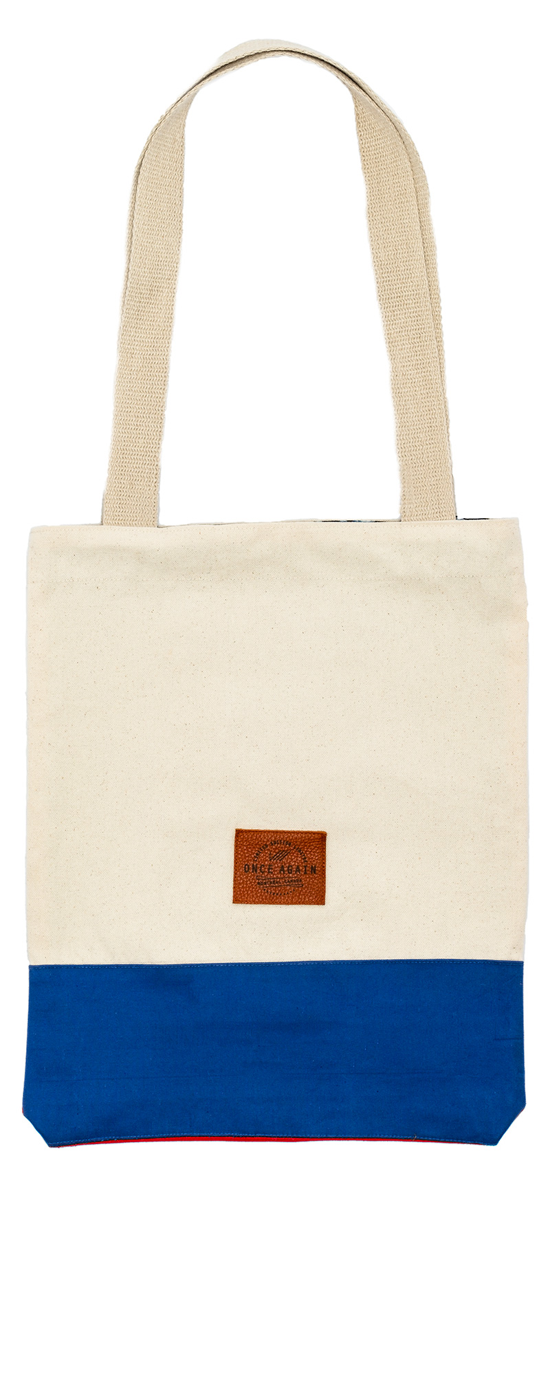 Tote bag in recycled materials with reinforced interior pocket.